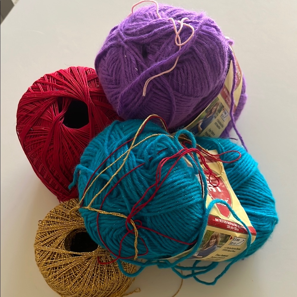 Vibrant Red and Purple Yarn Accents for Crafting